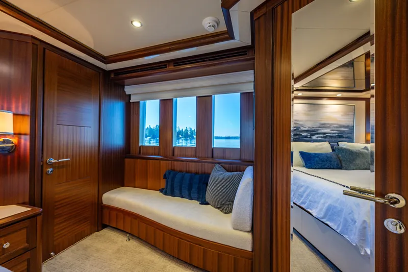 Slide: The Image of Luxurious interior of 2012 Ocean Alexander 85 E yacht with elegant wood paneling and cozy seating. - 68