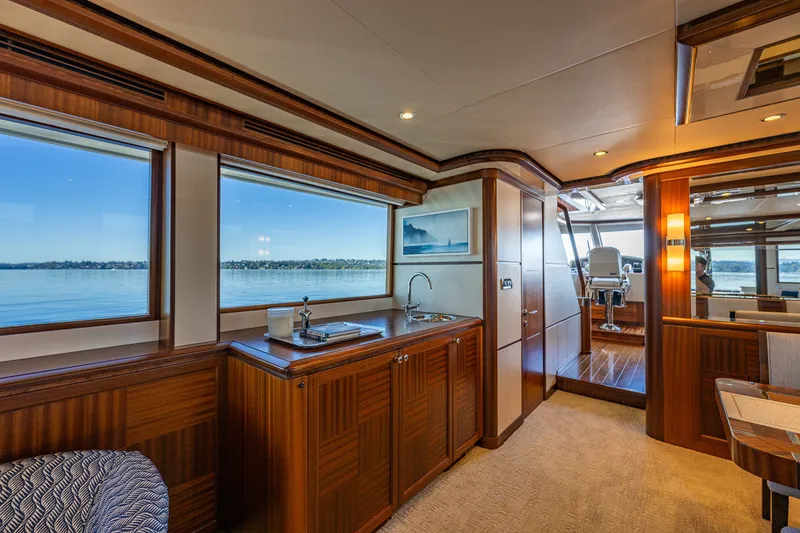 Slide: The Image of Luxurious interior of 2012 Ocean Alexander 85 E yacht with elegant wood finishes and scenic windows. - 65