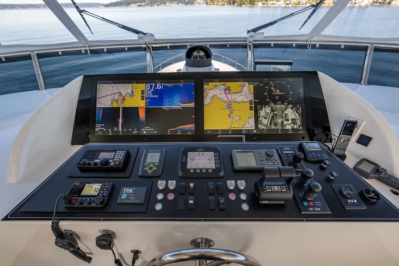 Slide: The Image of Cockpit of 2012 Ocean Alexander 85 E yacht with advanced navigation controls and displays. - 83