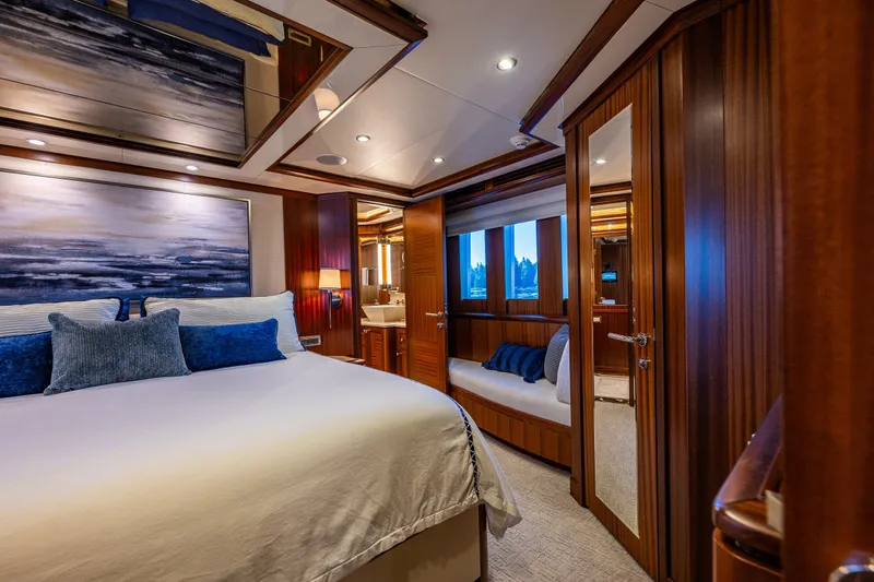 Slide: The Image of Luxurious bedroom interior of 2012 Ocean Alexander 85 E yacht with elegant wood paneling. - 36