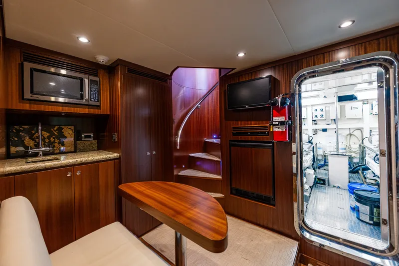 Slide: The Image of Luxurious interior of 2012 Ocean Alexander 85 E yacht with wood finishes and modern amenities. - 93