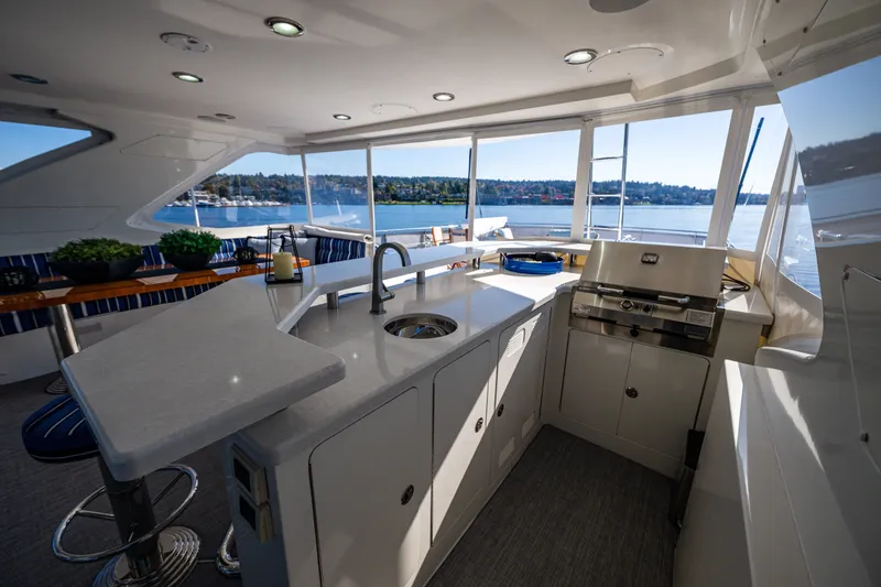 Slide: The Image of Luxurious 2012 Ocean Alexander 85 E yacht interior with modern kitchen and scenic water view. - 84