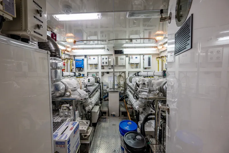 Slide: The Image of Engine room of 2012 Ocean Alexander 85 E yacht, featuring machinery and control panels. - 116
