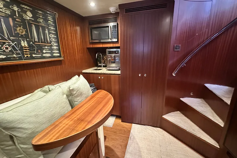 Slide: The Image of Luxurious interior of 2012 Ocean Alexander 85 E yacht with kitchenette and staircase. - 90