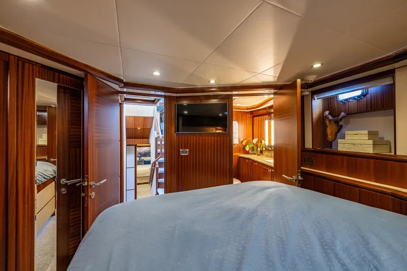 Slide: The Image of Luxurious interior of 2012 Ocean Alexander 85 E yacht cabin with wood paneling. - 50