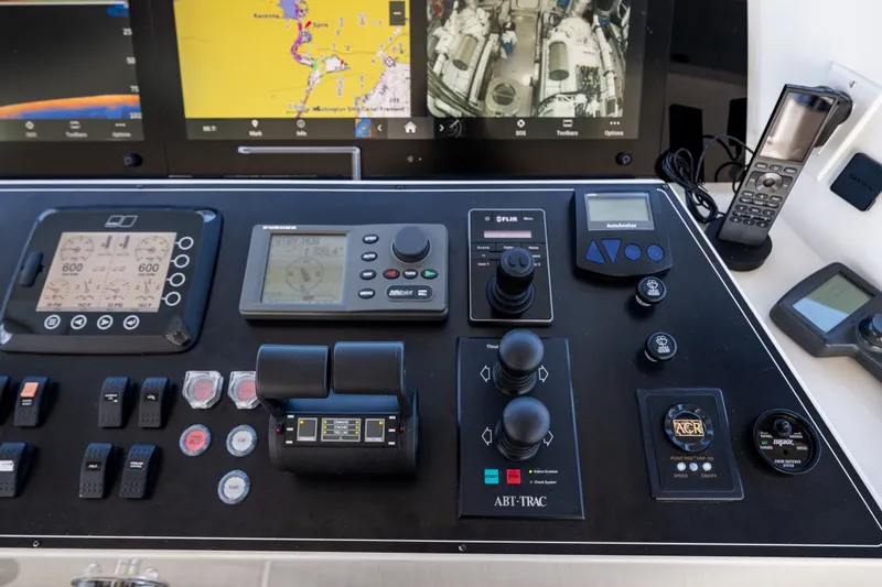 Slide: The Image of Control panel of a 2012 Ocean Alexander 85 E yacht with navigation and communication equipment. - 88