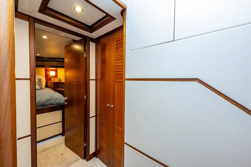 Slide: The Image of Luxurious interior of 2012 Ocean Alexander 85 E yacht with wood accents and cozy bedroom. - 58