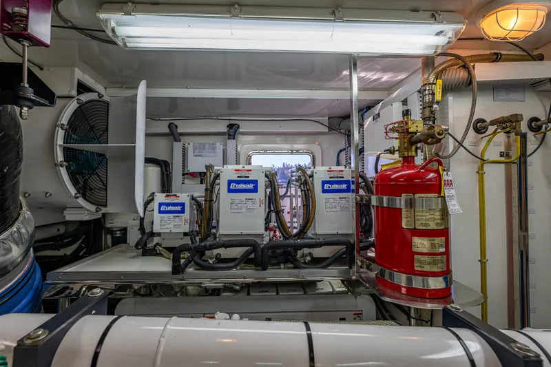 Slide: The Image of Engine room of 2012 Ocean Alexander 85 E yacht with Cruisair systems and fire extinguisher. - 114