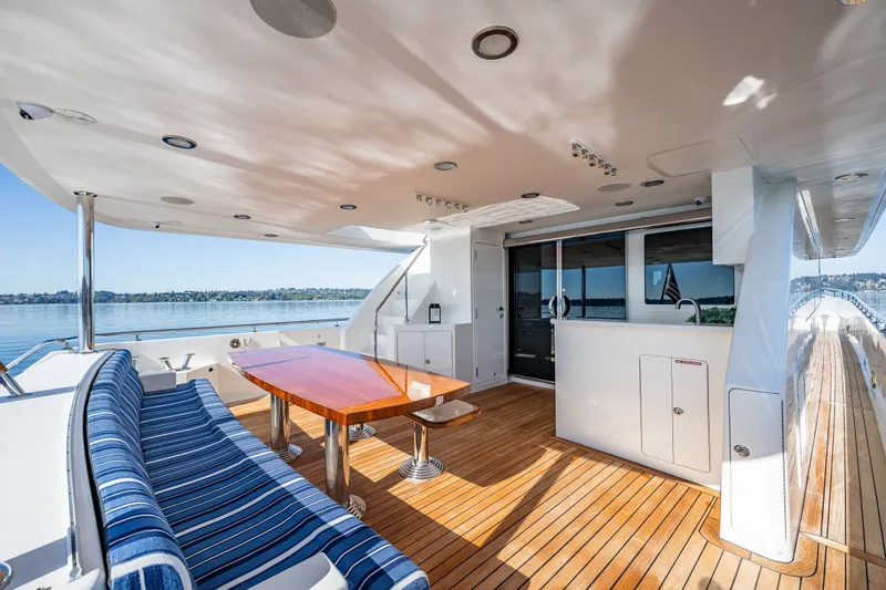 Slide: The Image of Luxurious 2012 Ocean Alexander 85 E yacht deck with elegant seating and dining area. - 18