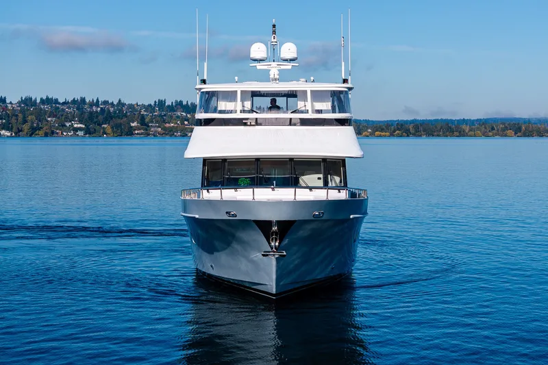 Slide: The Image of Front view of a 2012 Ocean Alexander 85 E yacht on calm water. - 14