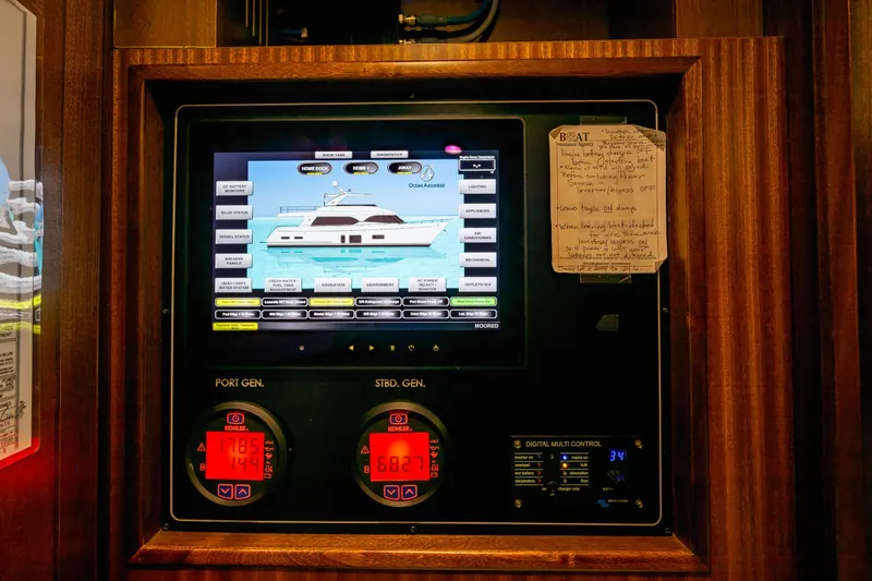 Slide: The Image of Control panel of a 2012 Ocean Alexander 85 E yacht with digital displays and notes. - 100