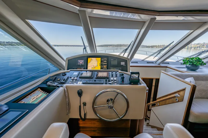 Slide: The Image of Cockpit of 2012 Ocean Alexander 85 E yacht with navigation controls and panoramic view. - 30