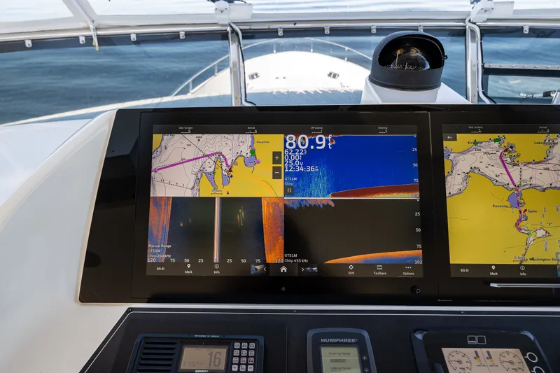 Slide: The Image of Navigation system on 2012 Ocean Alexander 85 E yacht, displaying maps and sonar data. - 87
