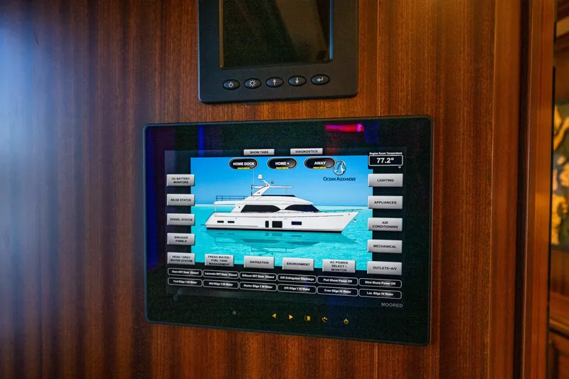 Slide: The Image of Control panel of a 2012 Ocean Alexander 85 E yacht, displaying vessel status and settings for Primary Stateroom - 44