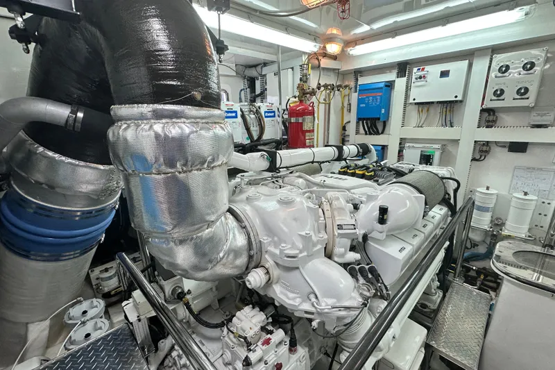 Slide: The Image of Engine room of a 2012 Ocean Alexander 85 E yacht, showcasing machinery and equipment. - 101