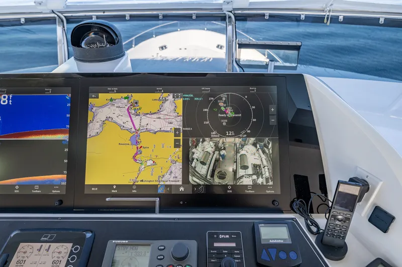 Slide: The Image of Cockpit of 2012 Ocean Alexander 85 E yacht with navigation screens and controls. - 78