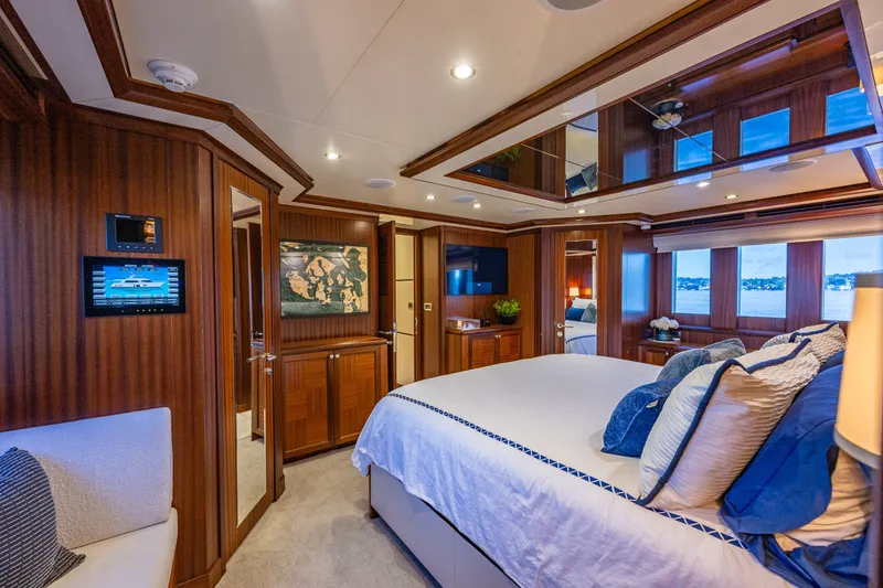 Slide: The Image of Luxurious bedroom interior of 2012 Ocean Alexander 85 E yacht with elegant wood paneling. - 33