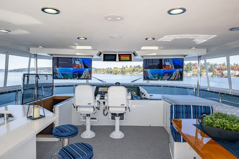 Slide: The Image of Luxurious 2012 Ocean Alexander 85 E yacht interior with helm, seating, and panoramic views. - 72