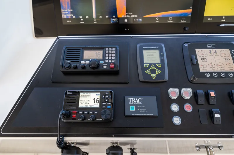 Slide: The Image of Control panel of a 2012 Ocean Alexander 85 E yacht with navigation and communication equipment. - 91