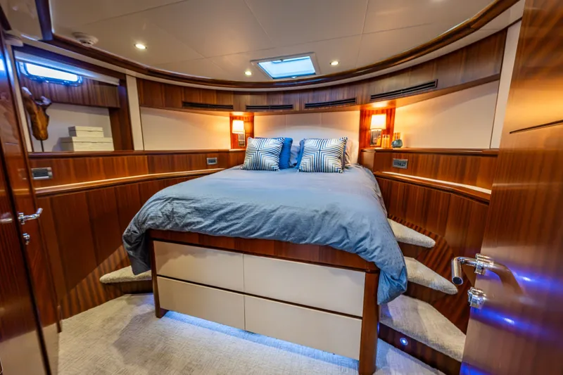 Slide: The Image of Luxurious bedroom interior of 2012 Ocean Alexander 85 E yacht with elegant wood paneling. - 49