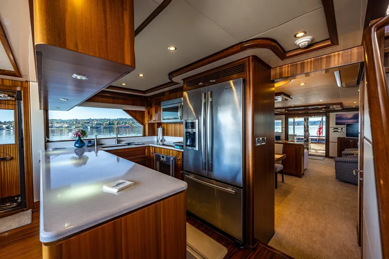 Slide: The Image of Luxurious interior of 2012 Ocean Alexander 85 E yacht with modern kitchen and scenic views. - 27