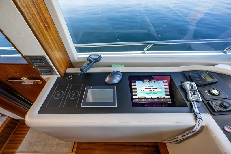Slide: The Image of Control panel of a 2012 Ocean Alexander 85 E yacht with touchscreen and navigation controls. - 31