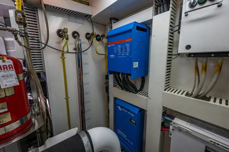 Slide: The Image of Engine room of 2012 Ocean Alexander 85 E yacht with electrical systems and fire protection. - 110