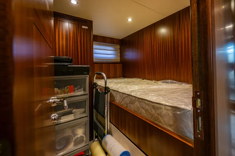 Slide: The Image of Cozy cabin interior of 2012 Ocean Alexander 85 E yacht with wooden paneling. - 74