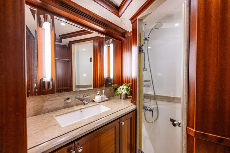 Slide: The Image of Luxurious bathroom in 2012 Ocean Alexander 85 E yacht with elegant wood finishes. - 48