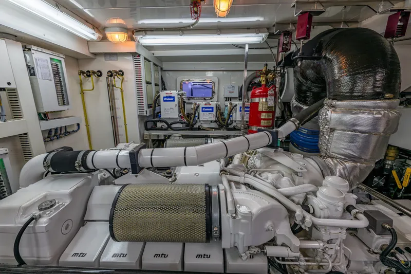 Slide: The Image of Engine room of 2012 Ocean Alexander 85 E yacht, featuring MTU engines and advanced equipment. - 107