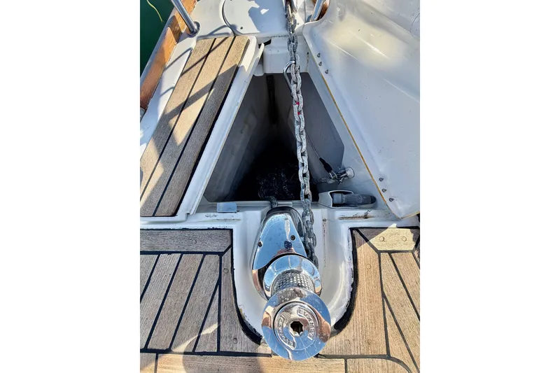 Slide: The Image of Anchor chain and windlass on 2007 Jeanneau Sun Odyssey 49 DS sailboat deck. - 20