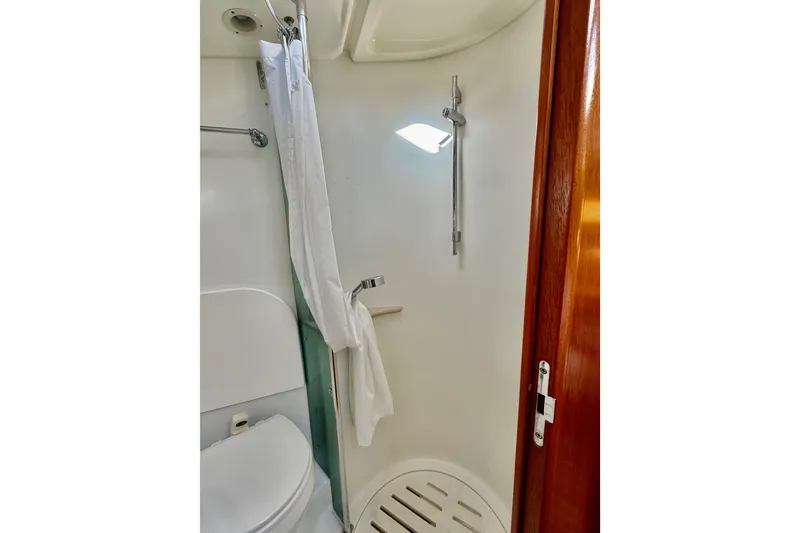 Slide: The Image of Bathroom interior of 2007 Jeanneau Sun Odyssey 49 DS yacht, featuring shower and wooden door. - 105