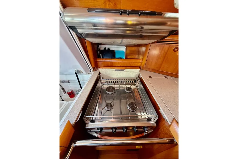 Slide: The Image of Galley kitchen in 2007 Jeanneau Sun Odyssey 49 DS sailboat with stainless steel stove. - 60