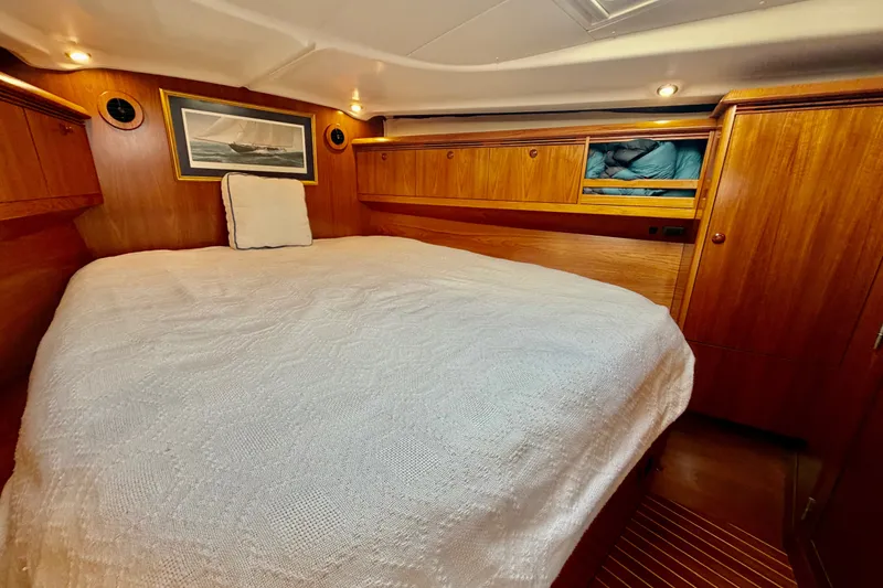 Slide: The Image of Cozy cabin interior of 2007 Jeanneau Sun Odyssey 49 DS with wood finish and bed. - 81