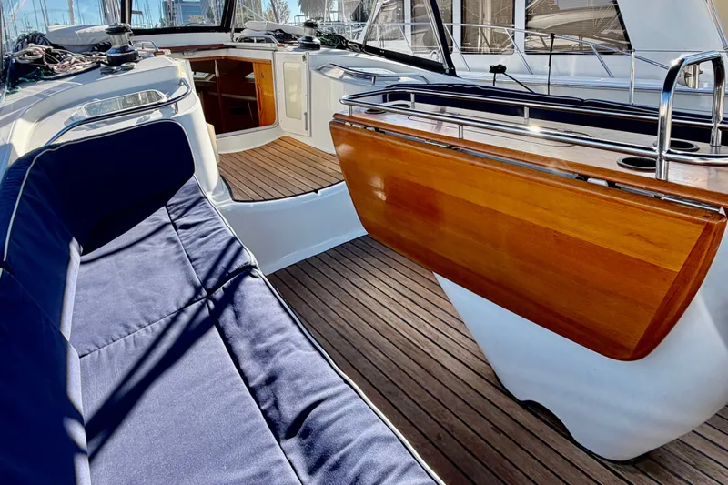 Slide: The Image of Luxurious Jeanneau Sun Odyssey 49 DS yacht cockpit with wooden accents and blue seating, 2007 model. - 34