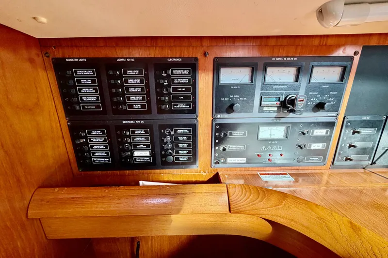 Slide: The Image of Control panel of a 2007 Jeanneau Sun Odyssey 49 DS sailboat, featuring navigation and electrical systems. - 64