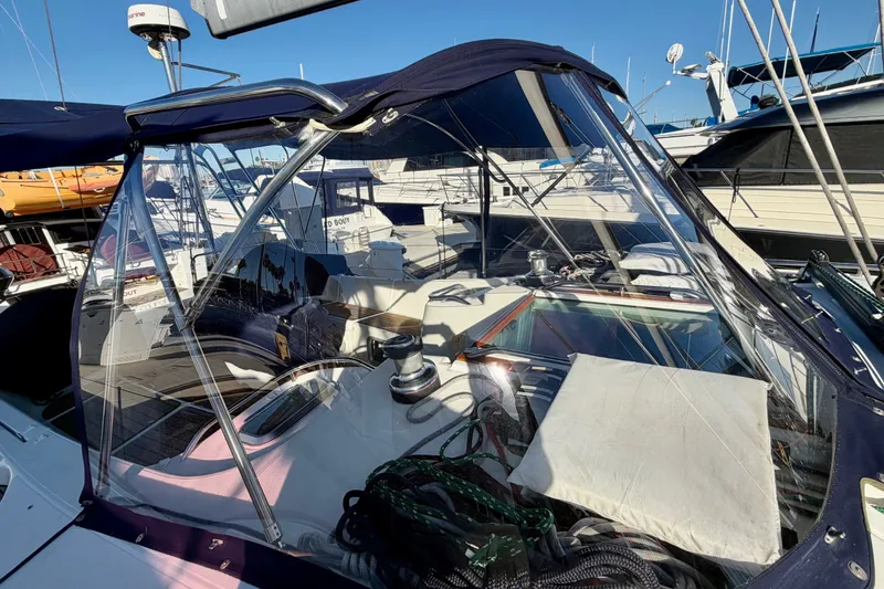 Slide: The Image of 2007 Jeanneau Sun Odyssey 49 DS sailboat cockpit with clear canopy and marina background. - 29