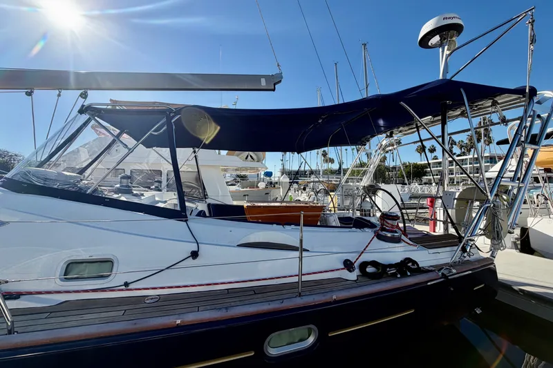 Slide: The Image of 2007 Jeanneau Sun Odyssey 49 DS sailboat docked under clear blue sky. - 48