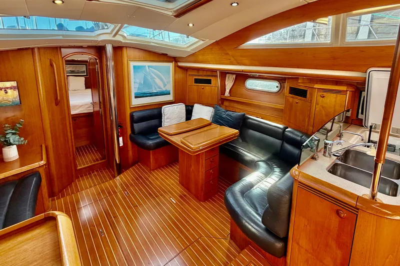 Slide: The Image of Luxurious interior of 2007 Jeanneau Sun Odyssey 49 DS yacht with elegant wood finish. - 70