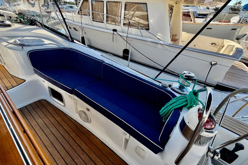 Slide: The Image of 2007 Jeanneau Sun Odyssey 49 DS yacht cockpit with blue seating and wooden deck. - 37