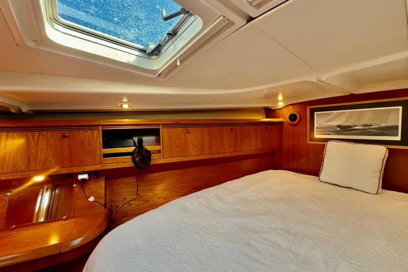 Slide: The Image of Cozy cabin interior of 2007 Jeanneau Sun Odyssey 49 DS with skylight and wooden cabinetry. - 79