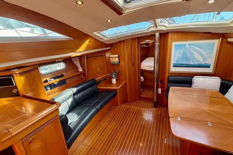 Slide: The Image of Luxurious interior of 2007 Jeanneau Sun Odyssey 49 DS sailboat with elegant wood finish. - 102
