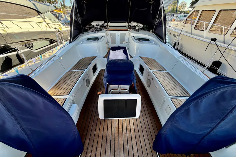 Slide: The Image of 2007 Jeanneau Sun Odyssey 49 DS yacht cockpit with teak flooring and blue covers. - 12