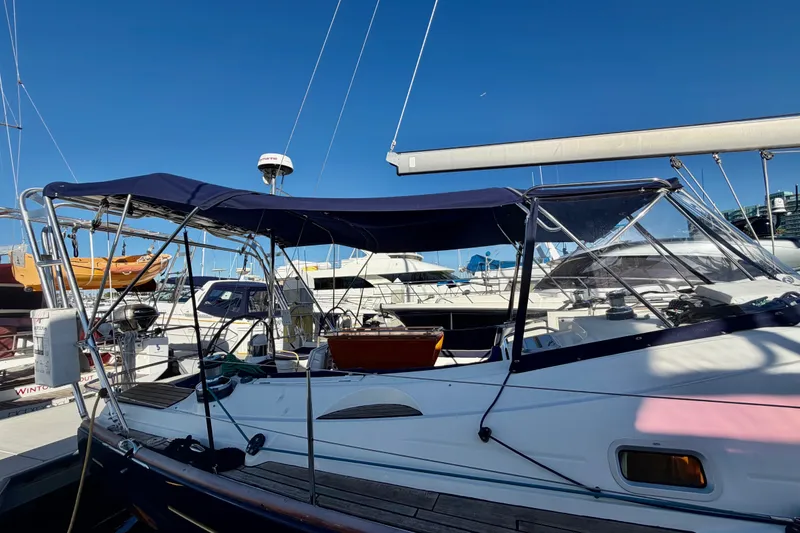Slide: The Image of 2007 Jeanneau Sun Odyssey 49 DS sailboat docked at marina under clear blue sky. - 47