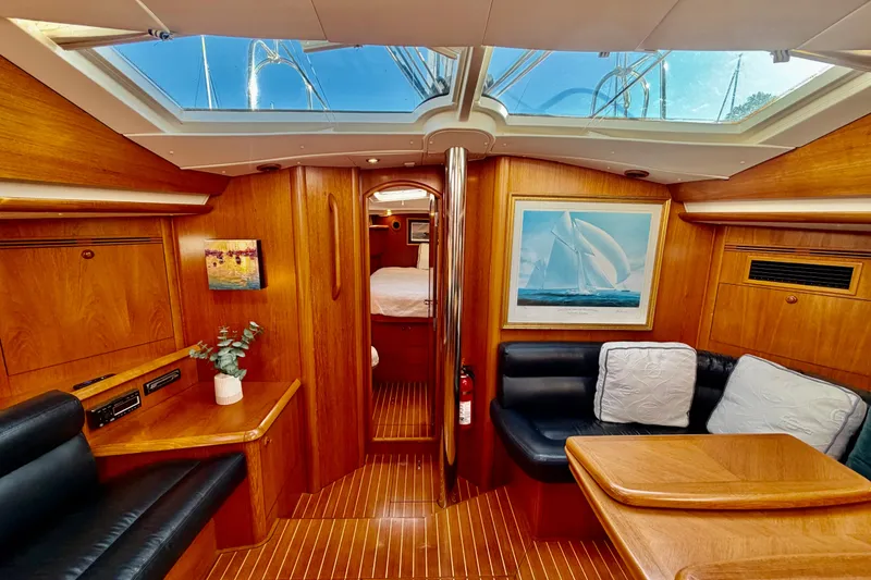 Slide: The Image of Luxurious interior of 2007 Jeanneau Sun Odyssey 49 DS sailboat with wood finish and skylight. - 54