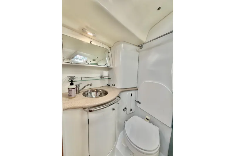 Slide: The Image of 2007 Jeanneau Sun Odyssey 49 DS yacht bathroom with sink, mirror, and toilet. - 106