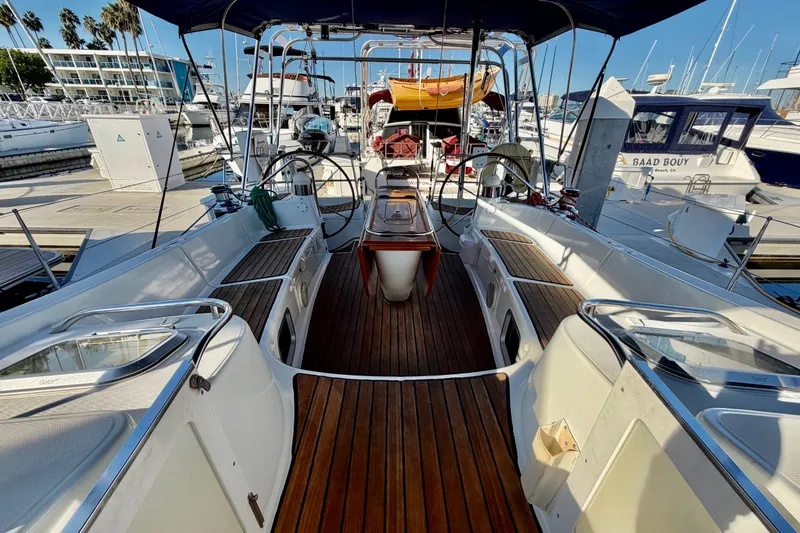 Slide: The Image of 2007 Jeanneau Sun Odyssey 49 DS sailboat with spacious deck and dual steering wheels at marina. - 46