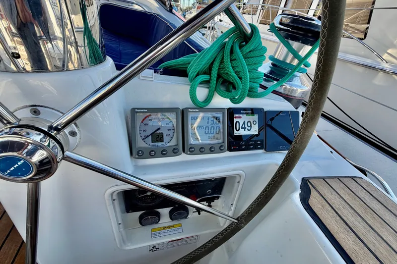 Slide: The Image of Cockpit of 2007 Jeanneau Sun Odyssey 49 DS with navigation instruments and green rope. - 35