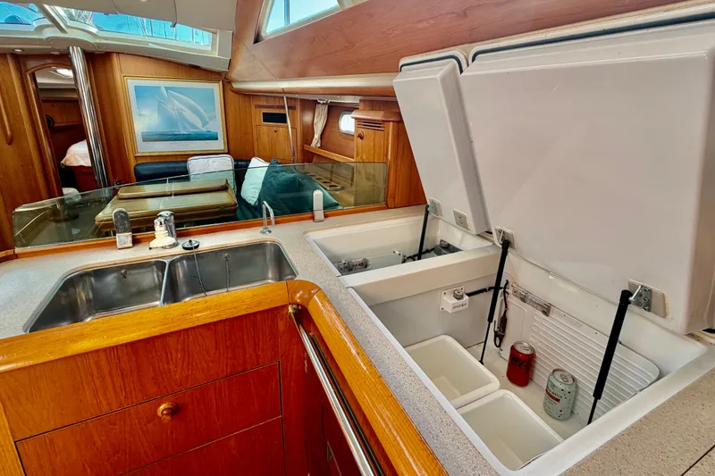 Slide: The Image of Interior of 2007 Jeanneau Sun Odyssey 49 DS yacht, featuring a modern kitchen area. - 58