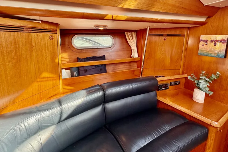 Slide: The Image of Luxurious interior of 2007 Jeanneau Sun Odyssey 49 DS yacht with leather seating and wood finish. - 55